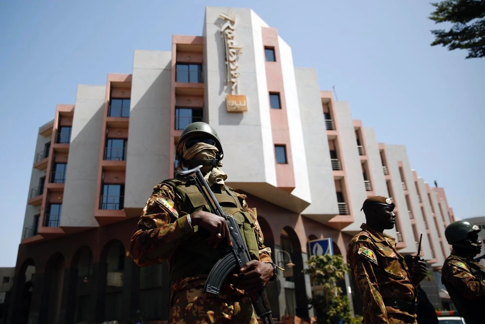 Soldiers stand guard in front of the Radisson Blu hotel prior to the visit of Malian President Ibrahim Boubacar Keita in Bamako, Mali, Nov. 21, 2015. (AP)