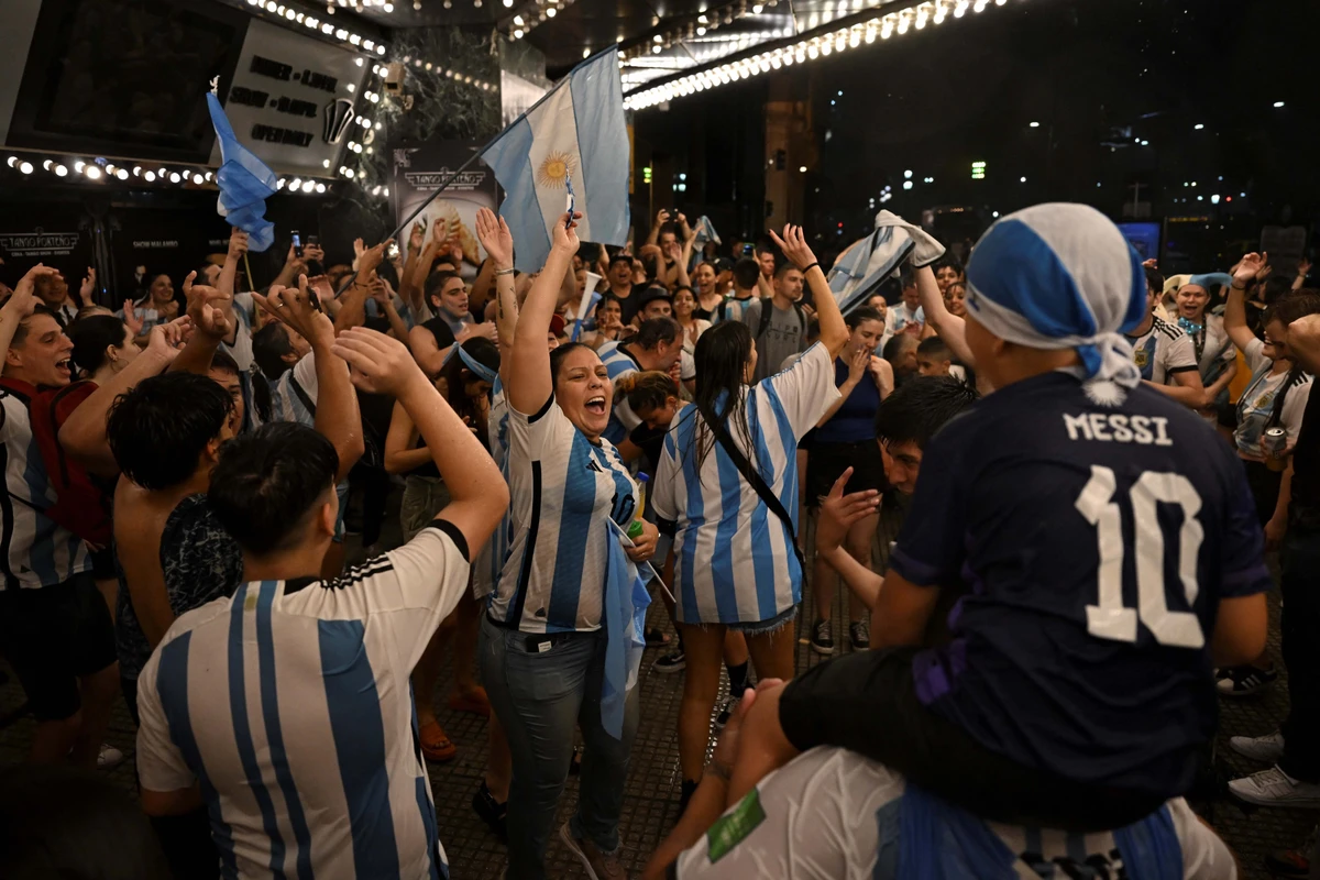 Fans of Argentina celebrate their team's victory in the Qatar 2022 World Cup quarter-final match against The Netherlands. AFP
