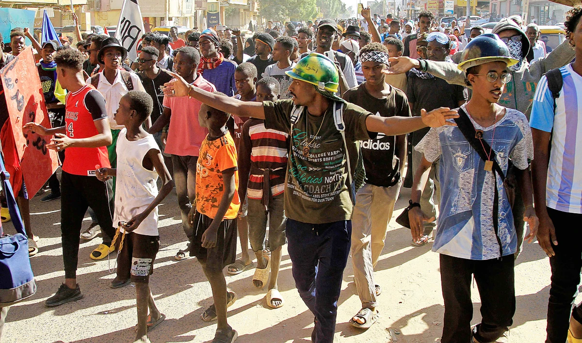Sudanese take to the streets of Khartoum in protest against the deal. (AFP)