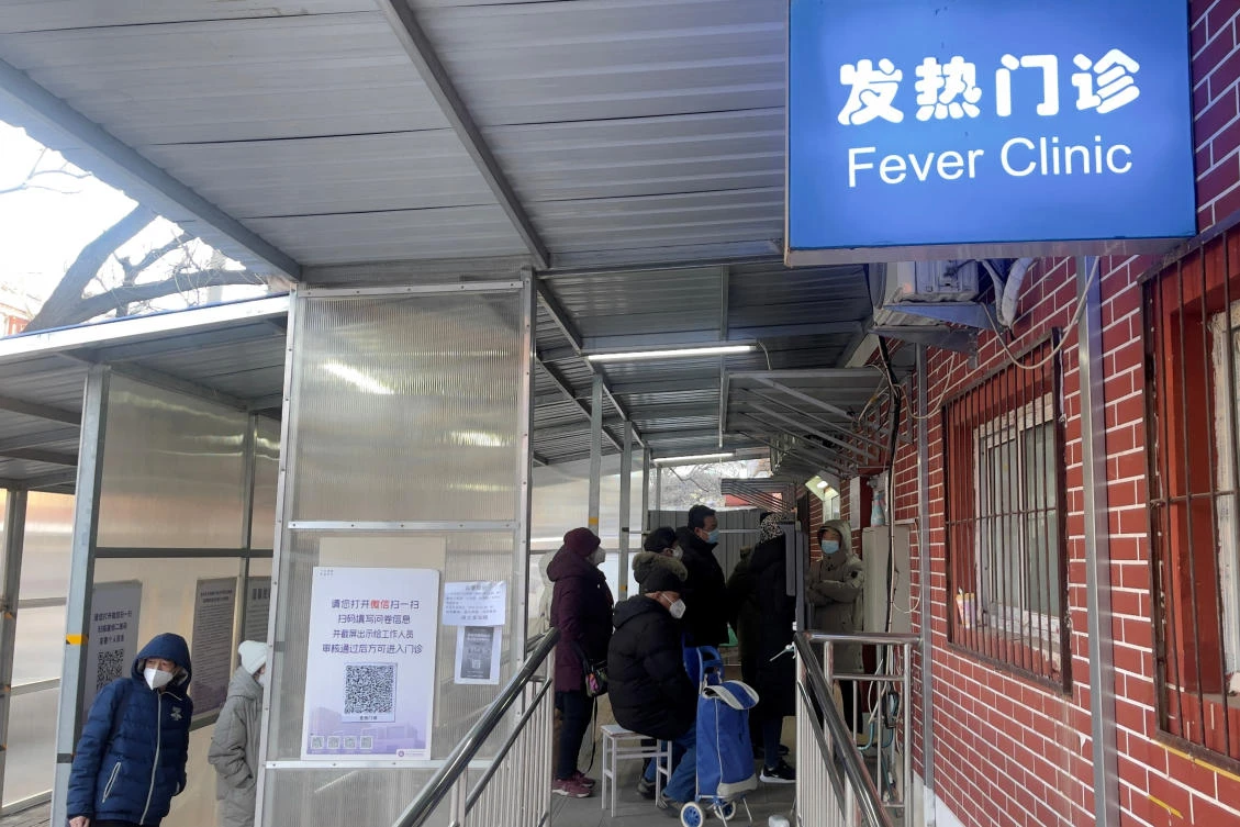 There are increasing signs of chaos during China’s exit from the zero COVID-19 policy — with long queues outside fever clinics. (Reuters)
