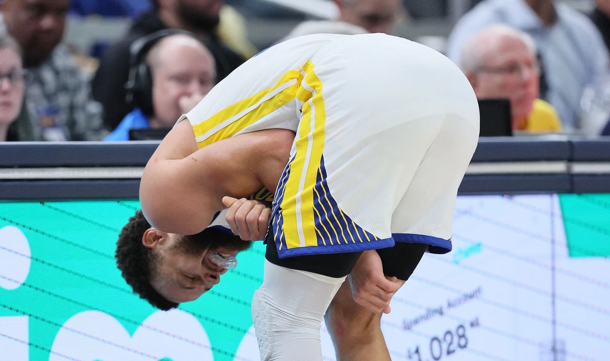Stephen Curry of the Golden State Warriors grimaces after being hurt in the third quarter of the game against the Indiana Pacers at Gainbridge Fieldhouse on Wednesday in Indianapolis, Indiana. (AFP)