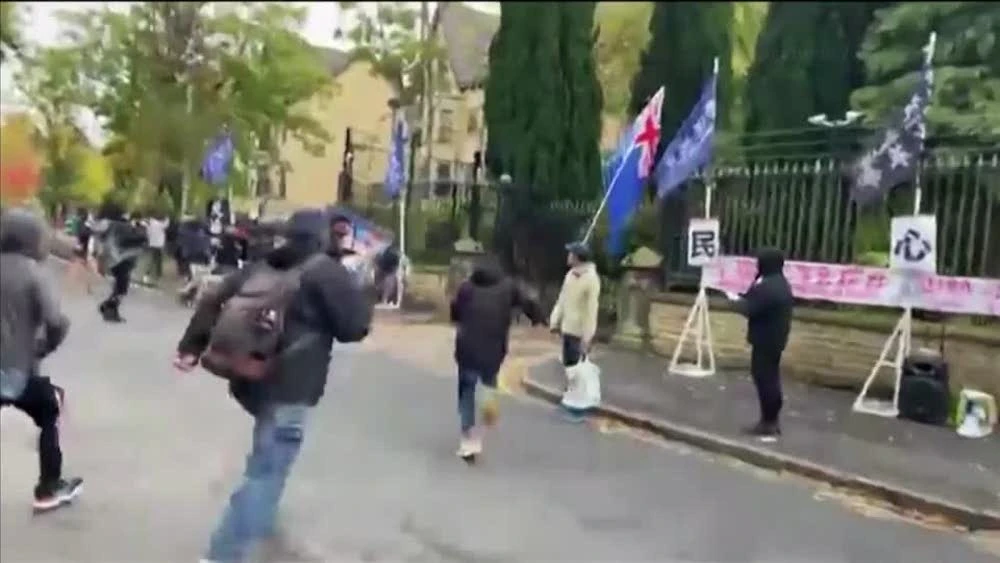 Diplomats responsible for an incident in October where a protester appeared to be pulled inside the grounds of the Chinese consulate and beaten have been removed. (Reuters)