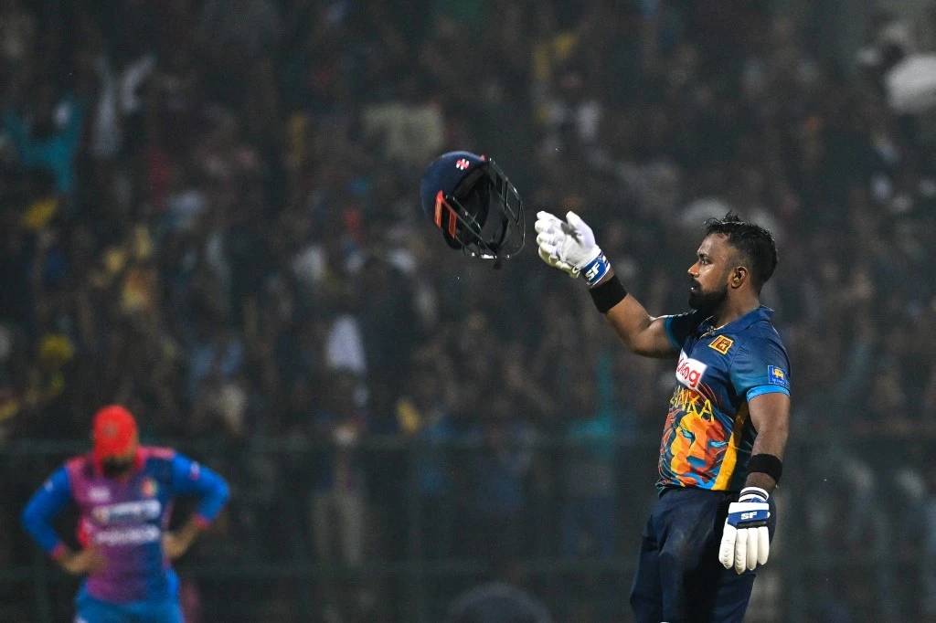 Sri Lanka’s Charith Asalanka celebrates after Sri Lanka won by 4 wickets during the third one-day international against Afghanistan at the Pallekele International Cricket Stadium in Kandy on Nov. 30, 2022. (AFP)