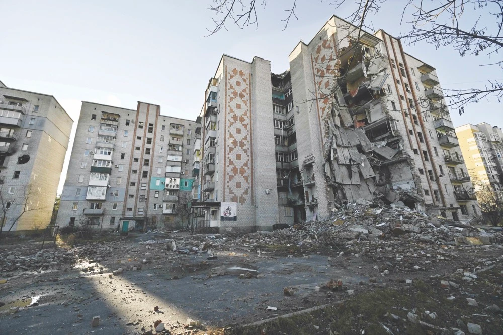 Residential buildings are seen heavily damaged following attacks in the town of Lyman, Donetsk region, amid the Russian invasion of Ukraine. (AFP)