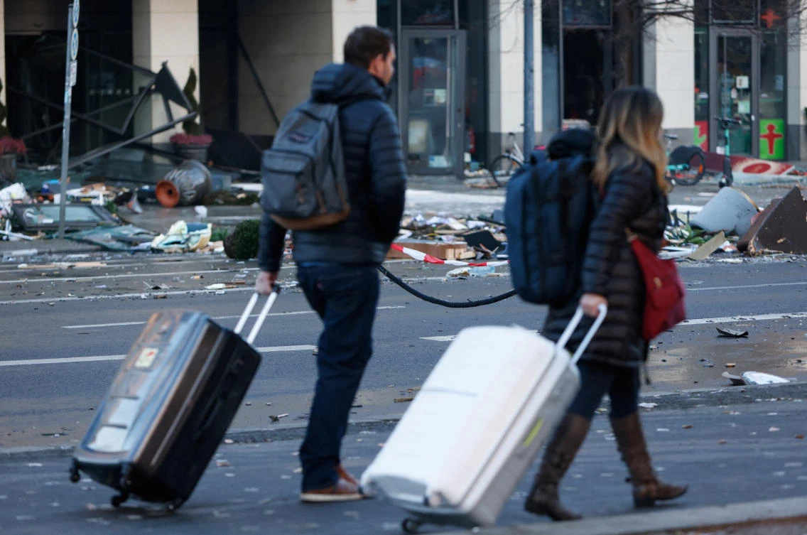 The debris spread on the street outside the hotel after the burst and leak of the AquaDom aquarium in central Berlin (Reuters)