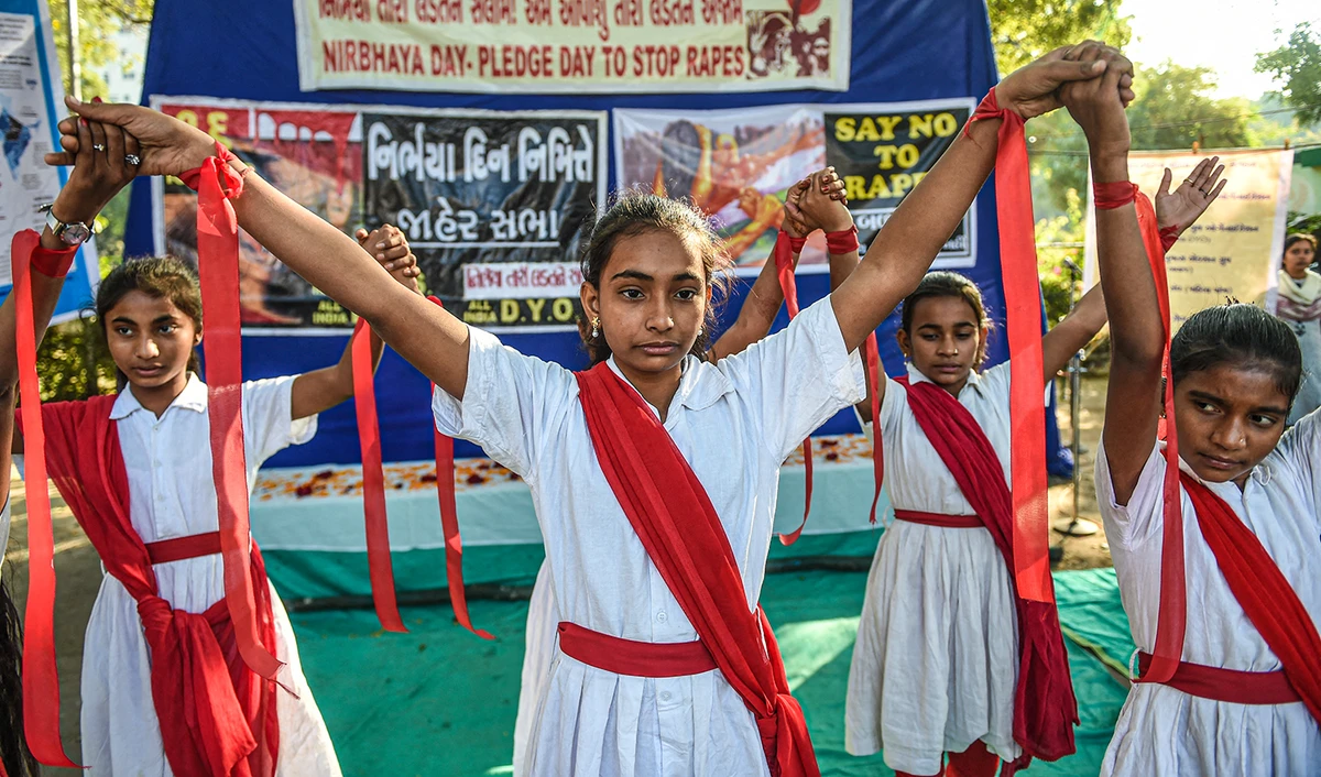 Students hold placards during 'Nirbhaya Day' to mark the anniversary of the brutal rape case of a 23-year-old physiotherapy student on a bus in New Delhi in 2012, in Ahmedabad on December 16, 2019. (AFP/File)