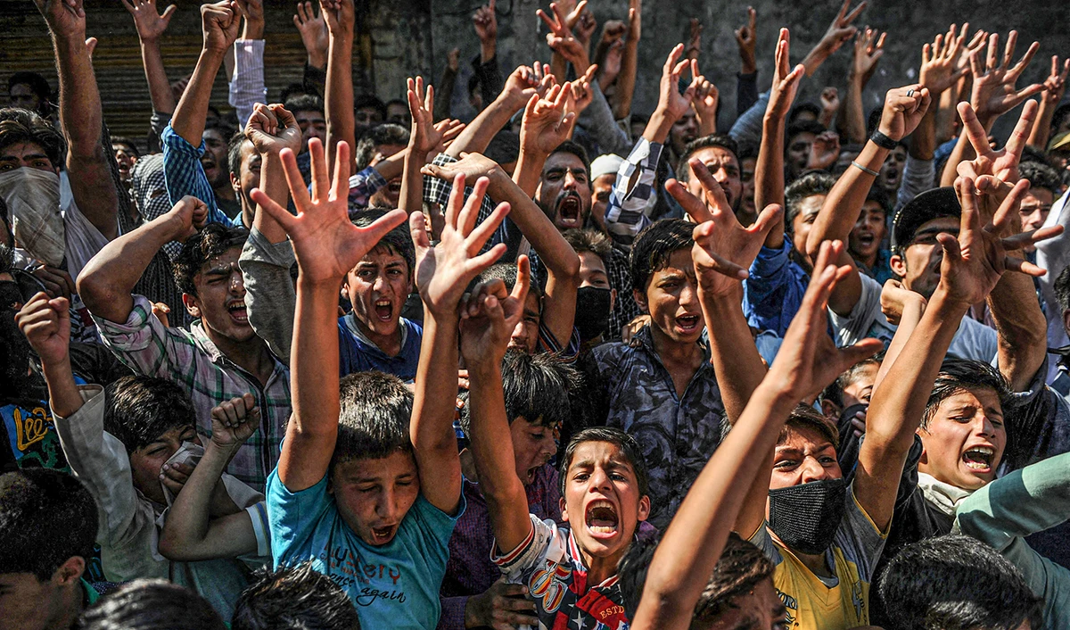 In this file photo, Kashmiris shout slogans during a protest against civilian killings in Srinagar on September 9, 2016. (AFP/File)