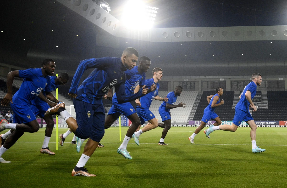 France's forward Kylian Mbappe (C) attends a training session with teammates at the Al Sadd SC training center in Doha on Friday ahead of their Qatar 2022 World Cup final against Argentina. (AFP)