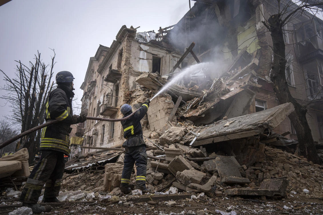 The volley of missiles unleashed Friday pitched multiple cities into darkness, cutting water and heat and forcing people to endure below-freezing temperatures. (AP Photo/)