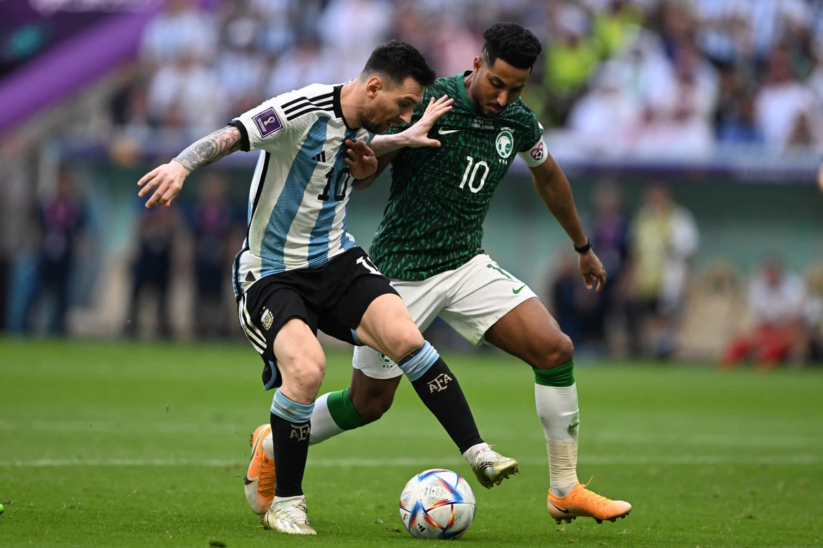 Argentina's Lionel Messi and Saudi Arabia's Salem Al-Dawsari during the Qatar 2022 World Cup Group C football match. AFP