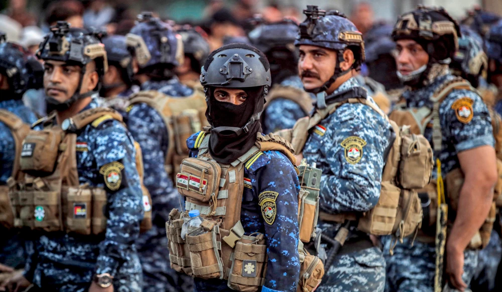 Iraqi security forces stand guard along Al-Jumhuriya (Republic) bridge, which connects Tahrir Square to the high-security Green Zone, in the capital Baghdad. (AFP file photo)