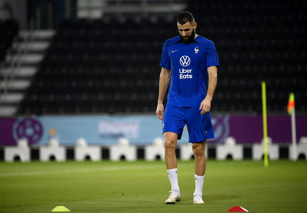 France's forward Karim Benzema looks down during a training session ahead of the Qatar 2022 World Cup football tournament. AFP