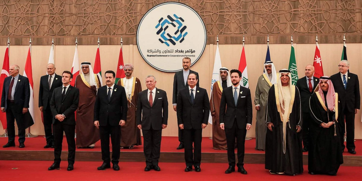 Dignitaries pose for a family photo at the start of the “Baghdad Conference for Cooperation and Partnership” in Sweimeh by the Dead Sea shore in central-west Jordan on December 20, 2022. (AFP)