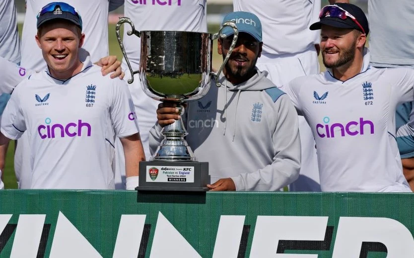 England’s Ollie Pope, left, Rehan Ahmed, center, and Ben Duckett after winning the third test and series against Pakistan, Karachi, Pakistan, Dec. 20, 2022. (AP Photo)