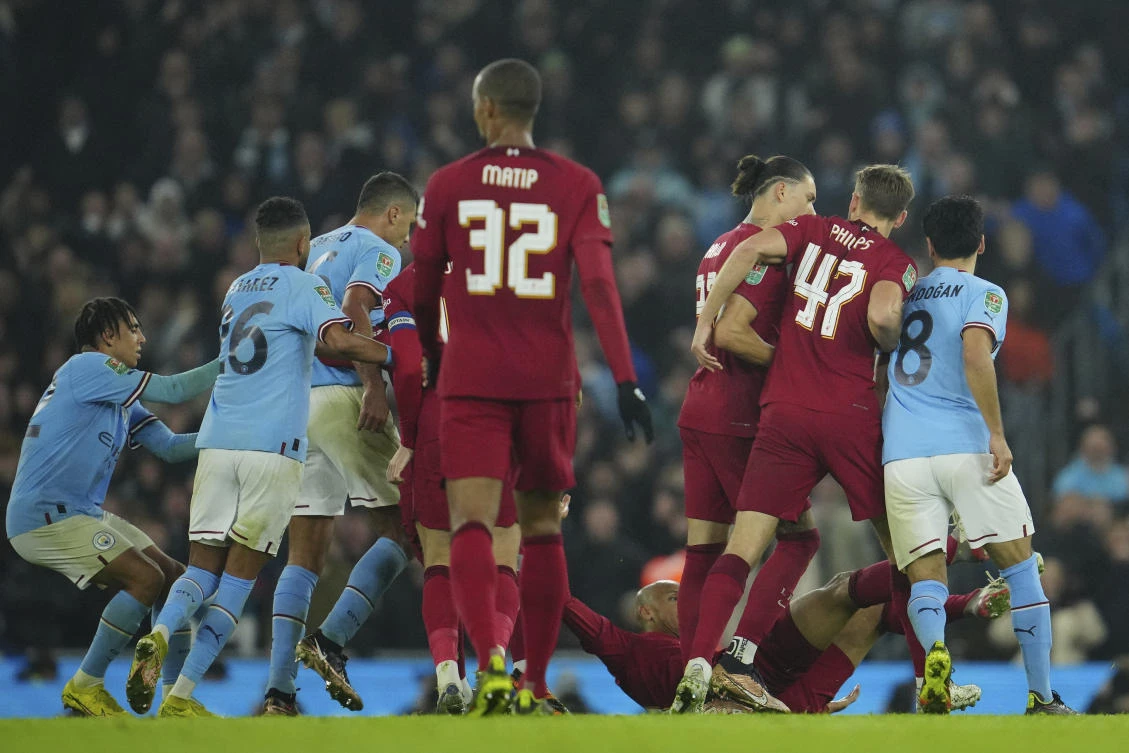 Players scuffle during the English League Cup match between Manchester City and Liverpool at Etihad stadium in Manchester on Dec. 22, 2022. (AP)