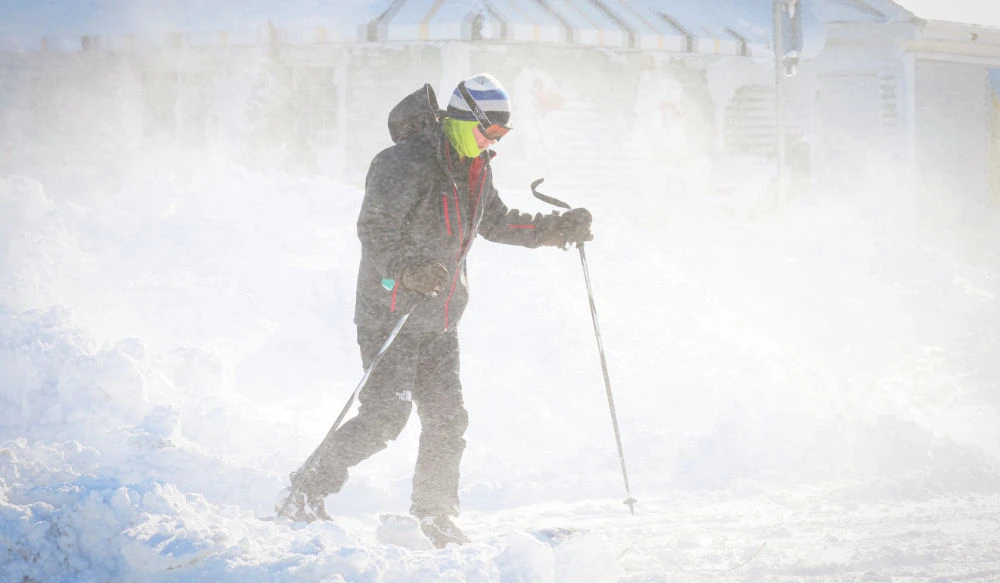 A man skis following a winter storm that hit the Buffalo region on Main St. in Amherst, New York, U.S., December 25, 2022. (REUTERS)