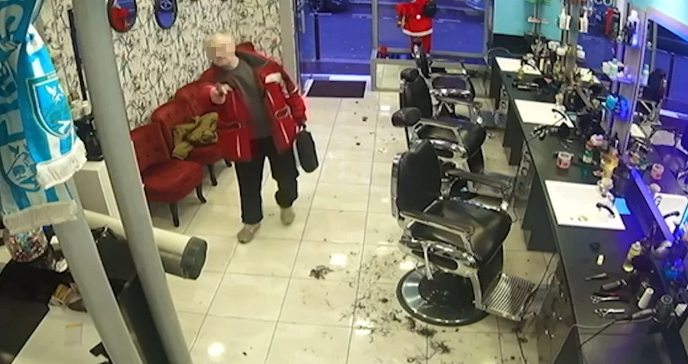 A screengrab taken from a surveillance video shows the 69-year-old French gunman entering a hairdressing salon in Paris. (AFP/HO)