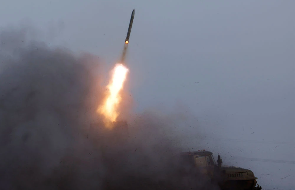 A Ukrainian BM-21 Grad multiple rocket launcher fires a rocket, as Russia's attack on Ukraine continues, during intense shelling on Christmas Day at the frontline in Bakhmut, Ukraine, December 25, 2022. (REUTERS)
