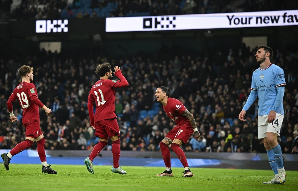 Liverpool striker Mohamed Salah, second left, celebrates after scoring the team’s second goal during their match between Manchester City on Dec. 22, 2022. (AFP)