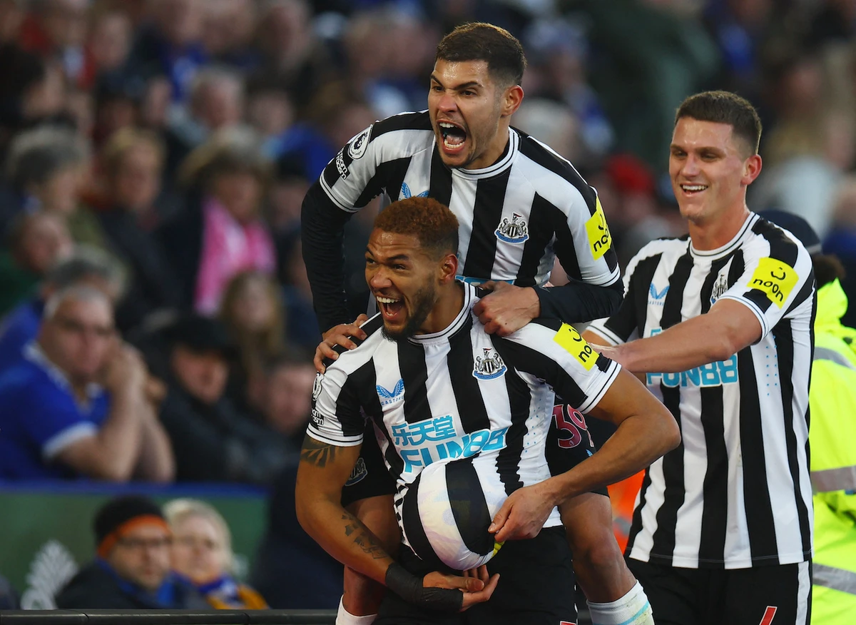 Newcastle United’s Joelinton celebrates scoring their third goal with teammates on December 26, 2022. (Reuters)