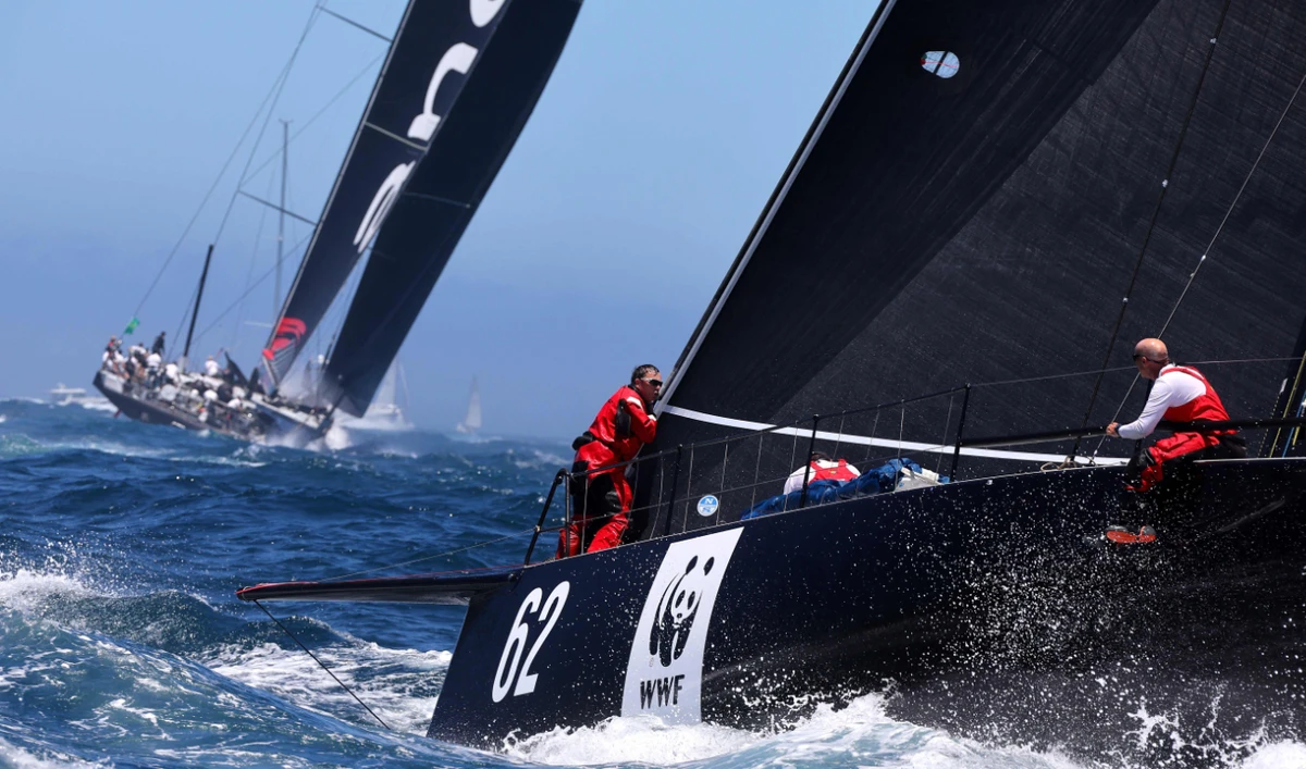 Yacht Whisper (R) chases Andoo Comanche at the start of the Sydney to Hobart yacht race Monday on Sydney Harbor. (AFP)