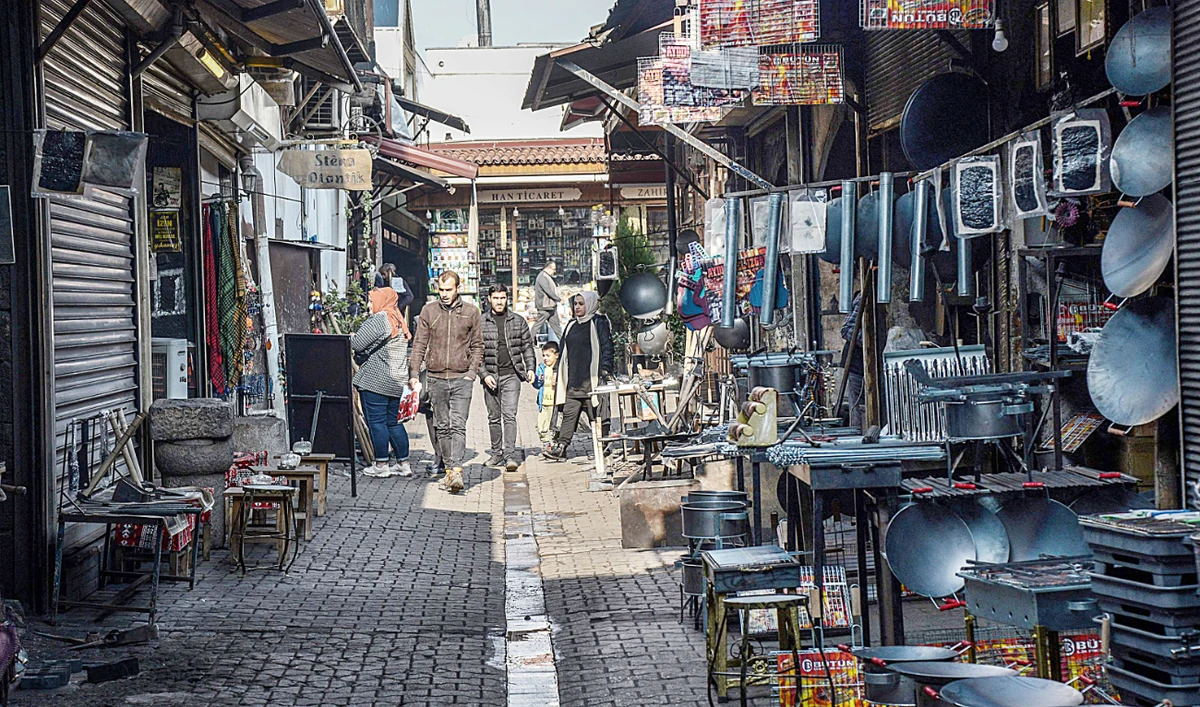 Pedestrians walk on a street in the historical Sur district in Diyarbakir. (AFP)