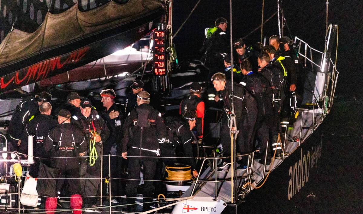 Crew from Andoo Comanche react after crossing the finish line to win the Sydney- Hobart yacht race in Hobart, Australia, in the early hours of Wednesday. (AAP Image via AP)