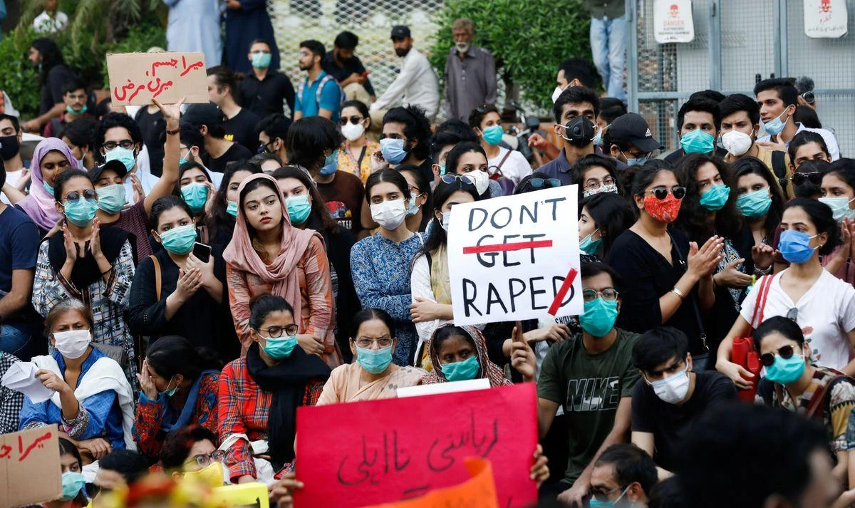 People carry signs against a gang rape that occurred along a highway and to condemn violence against women and girls, during a protest in Karachi. (Reuters)