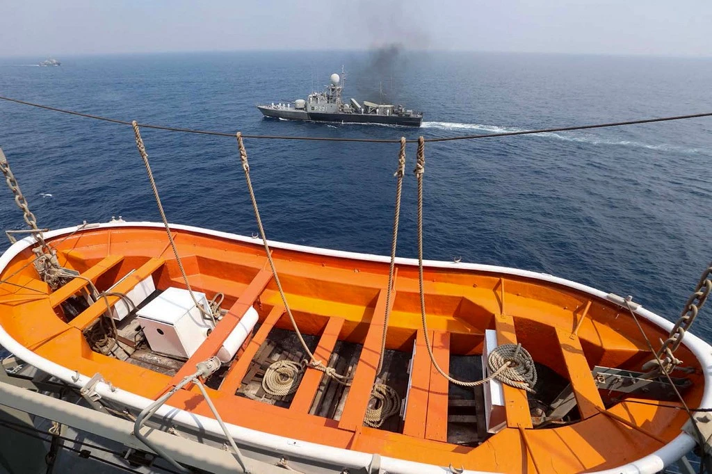 Above, an Iranian naval ship during a previous military exercise near the strategic strait of Hormuz in southern Iran. (Iranian Army office/AFP)