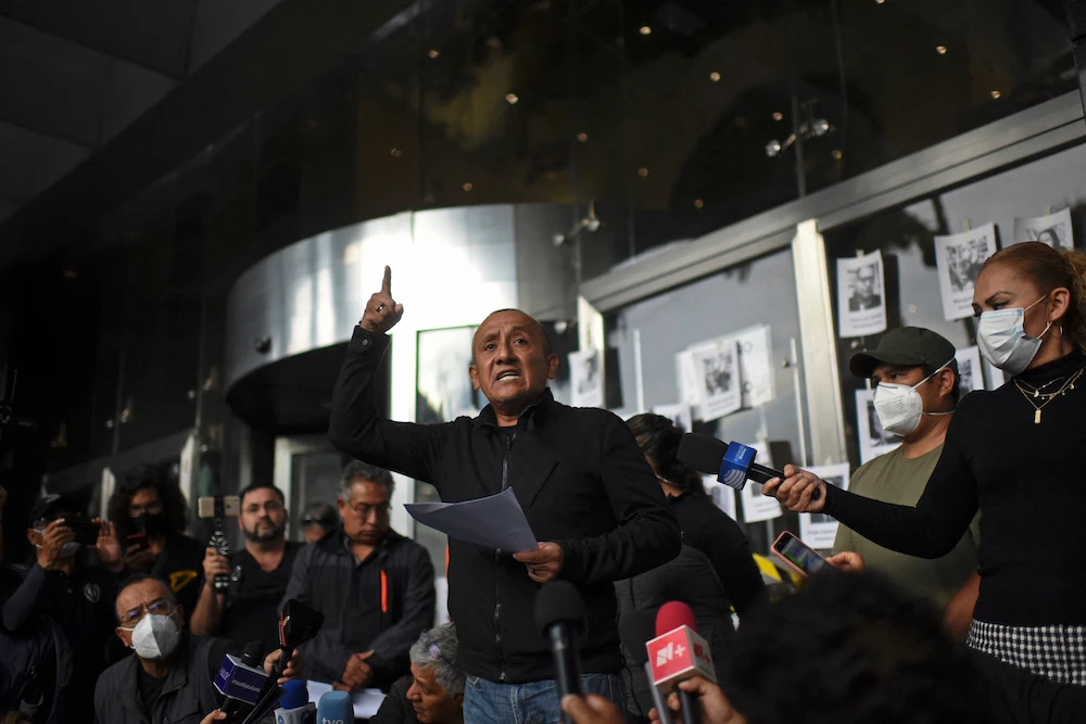 Mexican journalist Rodolfo Montes delivers a speech during a demonstration held by Mexican journalists to protest against the murder of their colleague Fredid Roman in Mexico City, on August 24, 2022. (AFP)