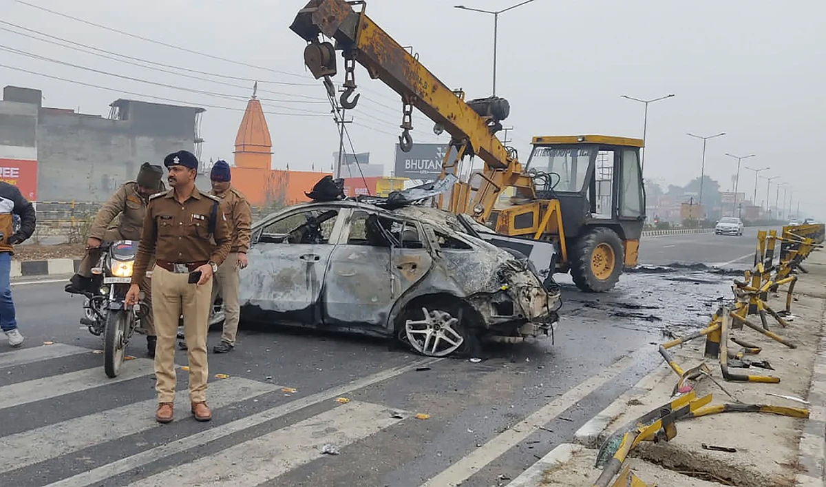 Policemen investigate the scene of a car accident near Roorkee, in the northern Indian state of Uttarakhand, on December 30, 2022. (AP)