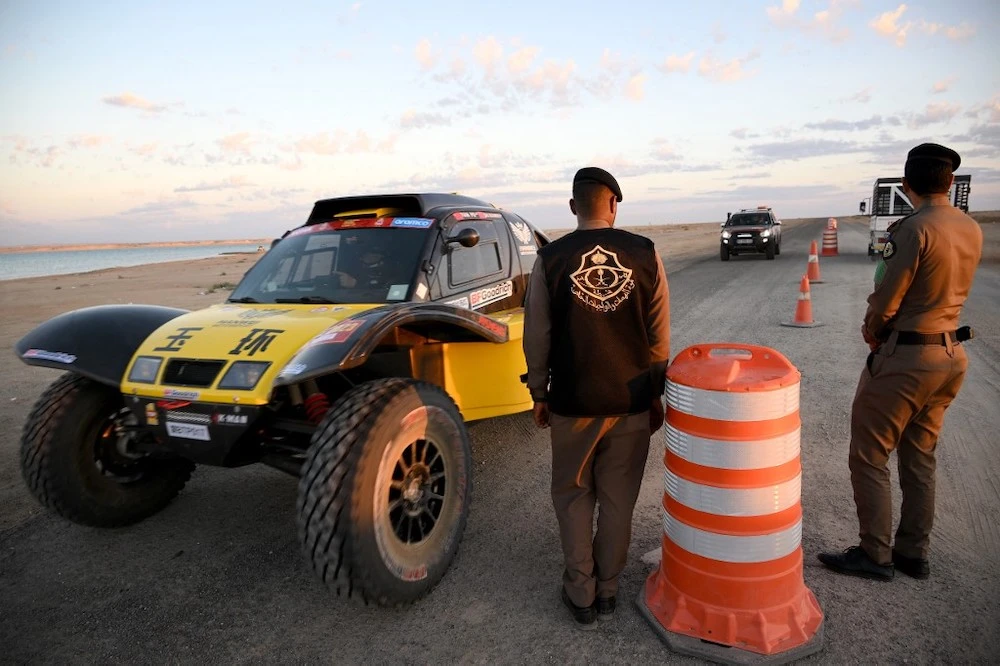 Above, drivers are controlled at the entrance of the bivouac by the Red Sea in Yanbu on Dec. 29, 2022, ahead of the 2023 Dakar Rally. (AFP)
