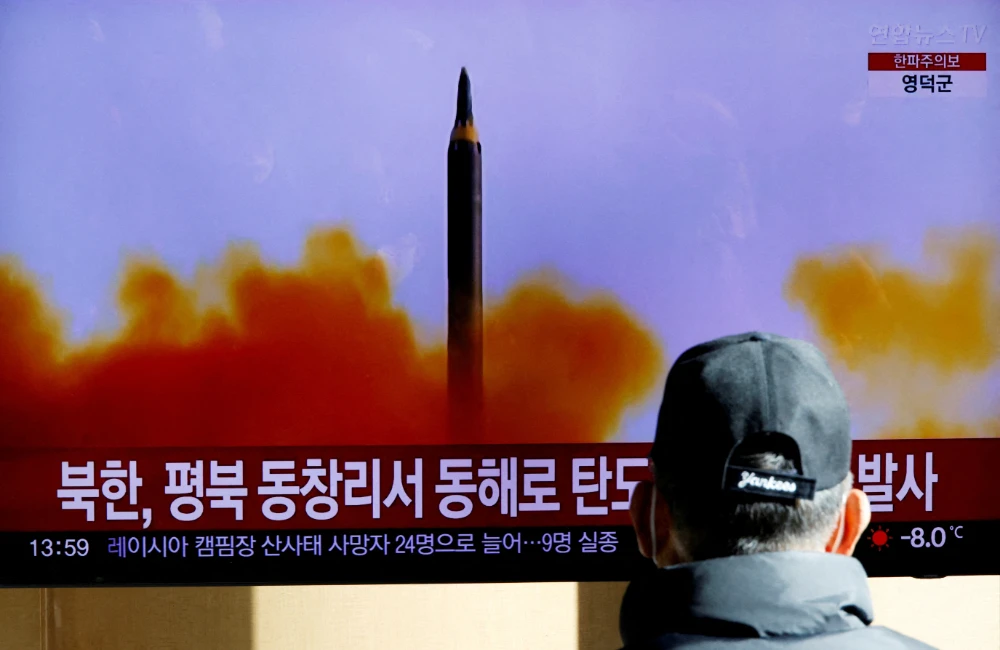 A man watches a TV broadcasting a news report on North Korea firing a ballistic missile off its east coast, in Seoul, South Korea, December 18, 2022. (REUTERS)