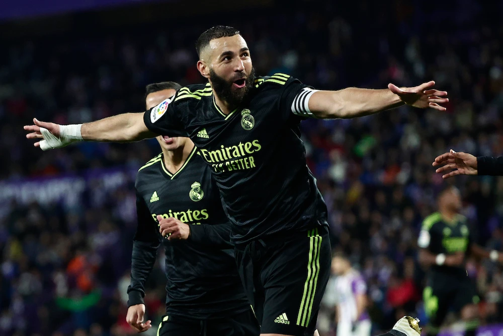 Real Madrid's Karim Benzema celebrates after scoring his side's second goal during a Spanish La Liga soccer match against Valladolid at the Jose Zorrilla stadium in Valladolid, Spain (AP)