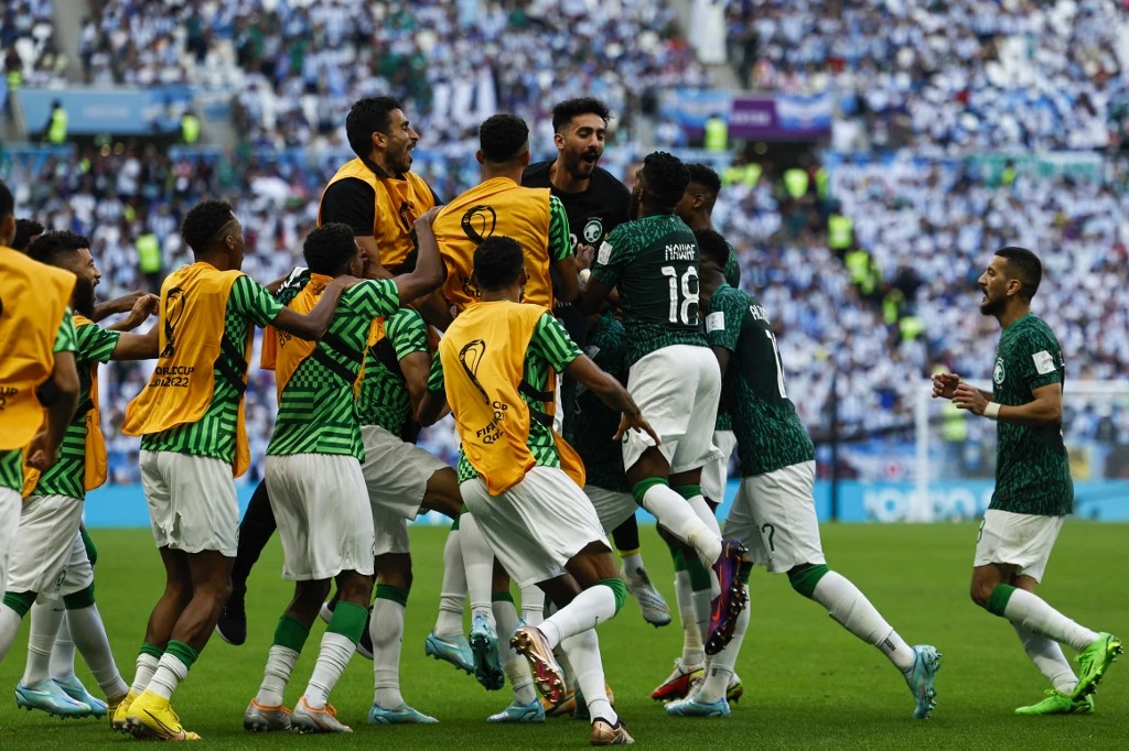 Saudi Arabia’s Green Falcons after Salem Al-Dawsari, center, scores the winning goal against Argentina during their group match of the Qatar 2022 World Cup in November. (AFP)