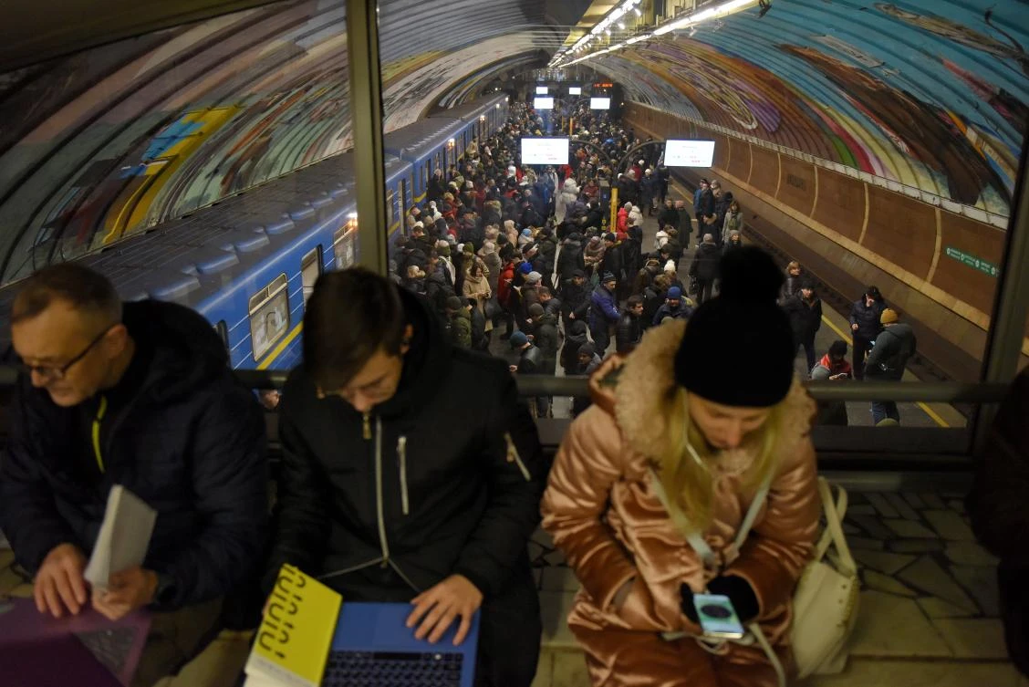Residents take shelter inside a metro station during an air raid alert in Kyiv (EPA)