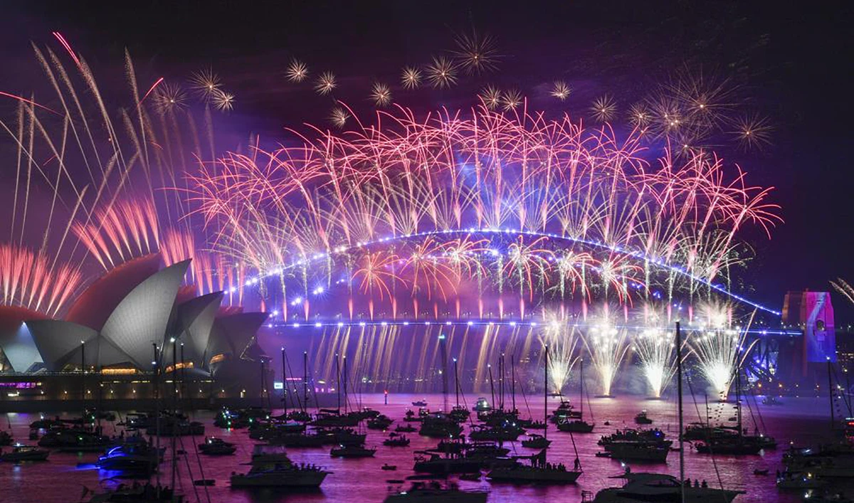 Fireworks explode over the Sydney Opera House and Harbour Bridge as New Year celebrations begin in Sydney, Australia, on January 1, 2023. (AAP Image via AP)