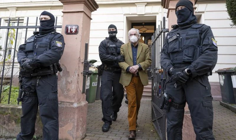 German police officers detain Heinrich XIII, Prince Reuss, following a raid in Frankfurt, Germany, Dec. 7, 2022. (Getty Images)