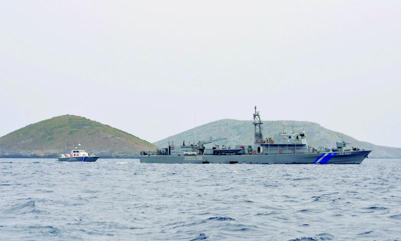 Greek Coast Guard vessels sail next to the Anthropofagos islets, near Fournoi island, in Greece. (Reuters)