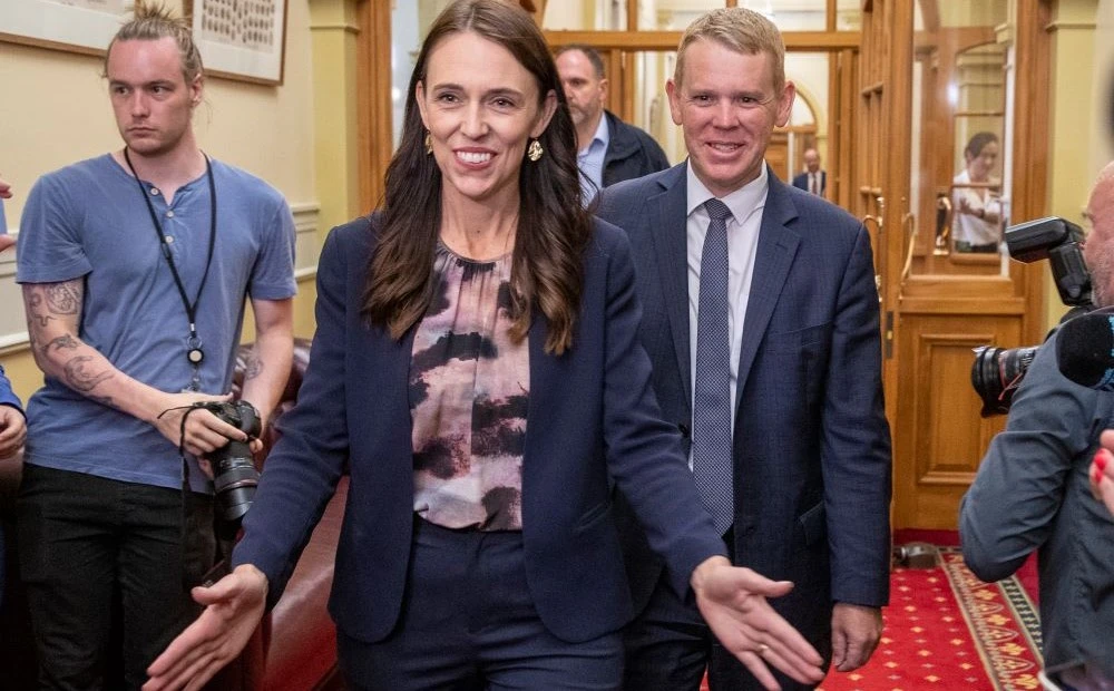 PM Jacinda Ardern and Labour Party leader Chris Hipkins arrive at Parliament, Wellington, New Zealand, Jan. 22, 2023. (AP Photo)