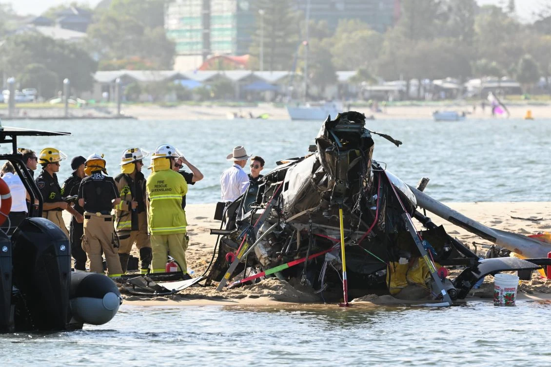 Australian rescue personnel inspect the scene of a helicopter collision near Seaworld on the Gold Coast on Jan. 2, 2023. (EPA)