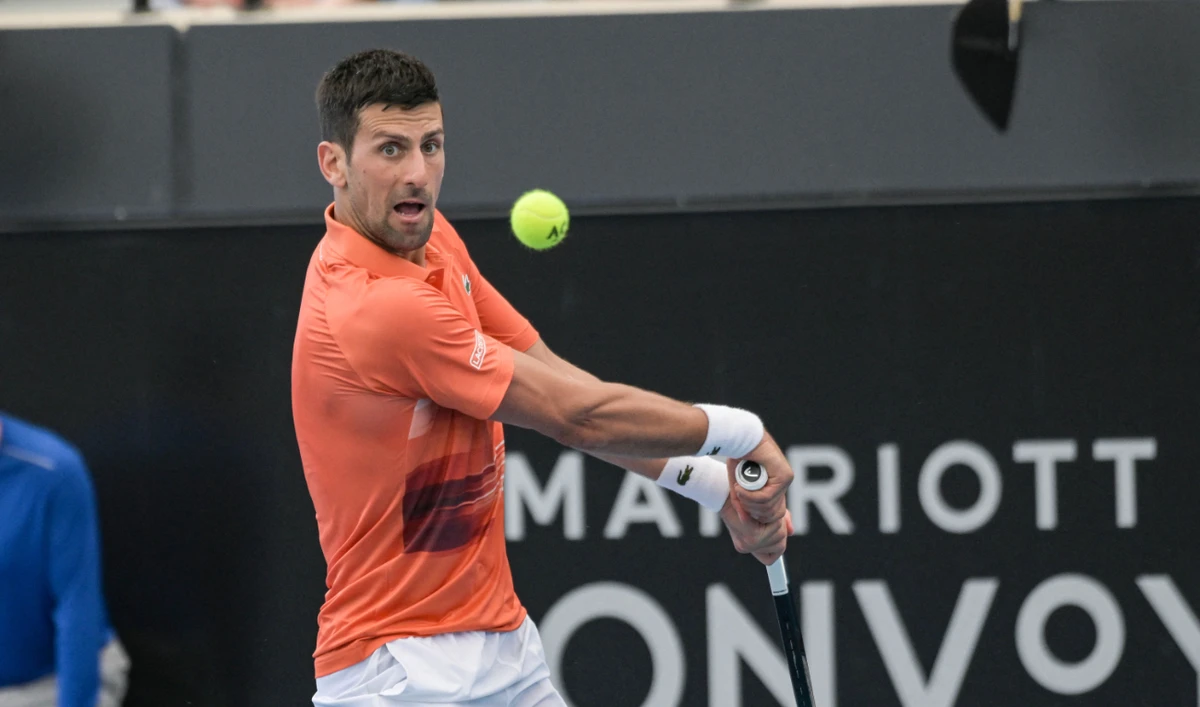 Novak Djokovic hits a return during his first round match against Constant Lestienne at the ATP Adelaide International tournament in Adelaide on January 3, 2023. (AFP)