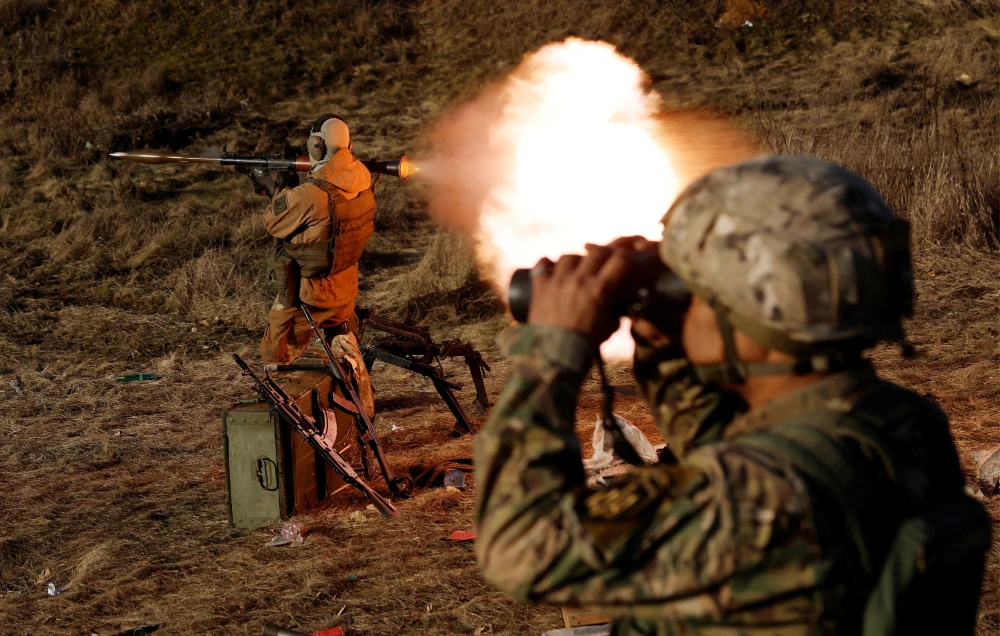 A soldier from Carpathian Sich international battalion fires an RPG while conducting manoeuvres near the front line, as Russia's attack on Ukraine continues, in Kreminna, Ukraine, January 3, 2023. (REUTERS)