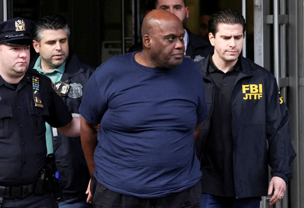Frank James, the suspect in the Brooklyn subway shooting walks outside a police precinct in New York City, New York, U.S., April 13, 2022. (REUTERS)