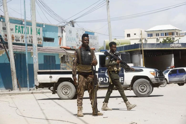 Police officers stand guard near Hayat Hotel in Mogadishu, Somalia August 21, 2022. (Reuters)