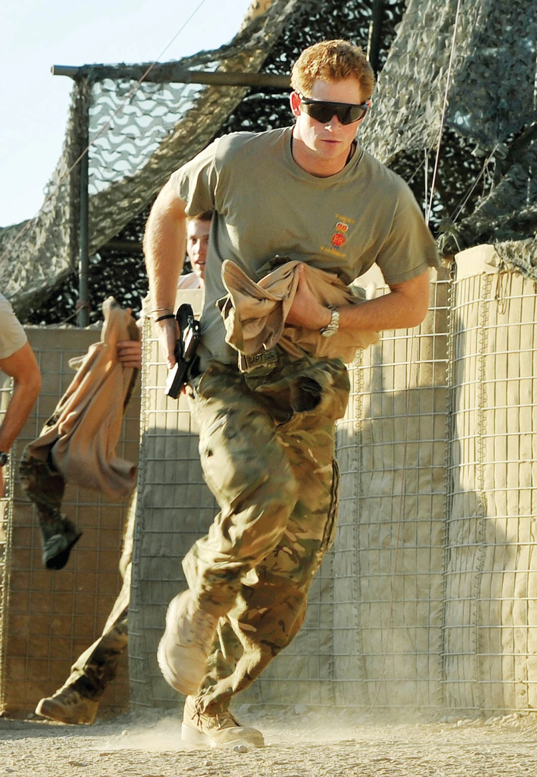Prince Harry scrambles to his attack helicopter in this Nov. 3, 2012 file photo. (AP)