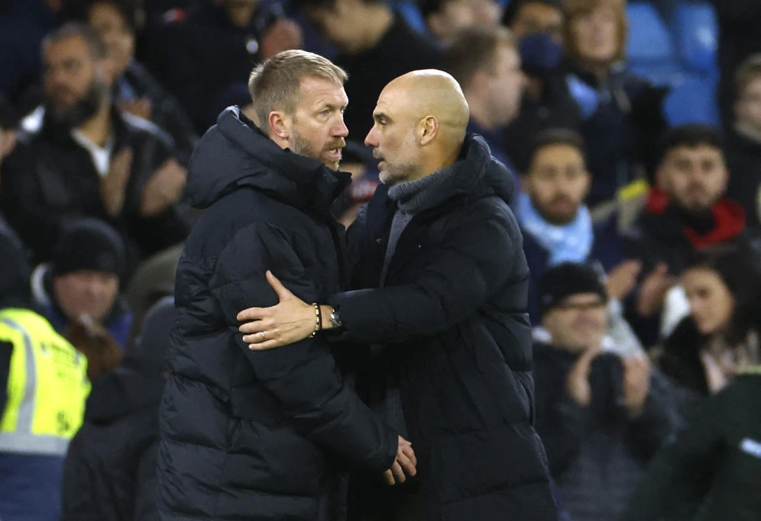 Manchester City manager Pep Guardiola with Chelsea manager Graham Potter after the FA Cup match, which finished 4-0 to the hosts, at the Etihad Stadium. (Action Images via Reuters)