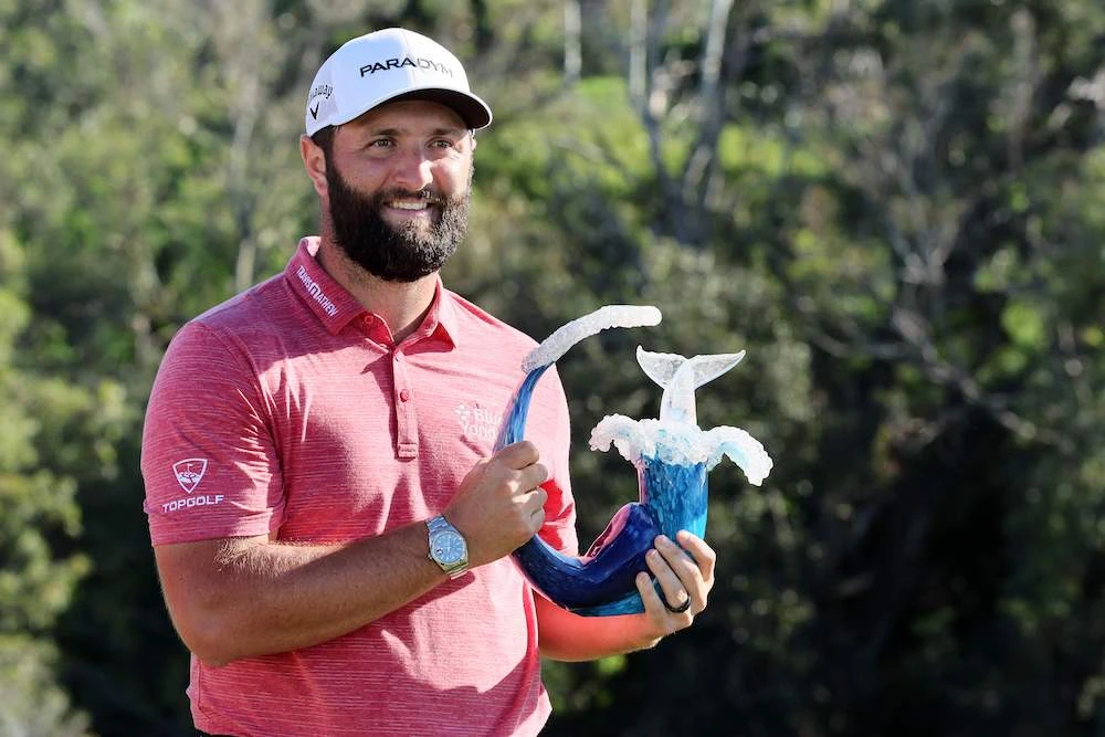 Jon Rahm of Spain with the trophy after winning during the final round of the Sentry Tournament of Champions at Plantation Course at Kapalua Golf Club on Sunday in Lahaina, Hawaii.(AFP)
