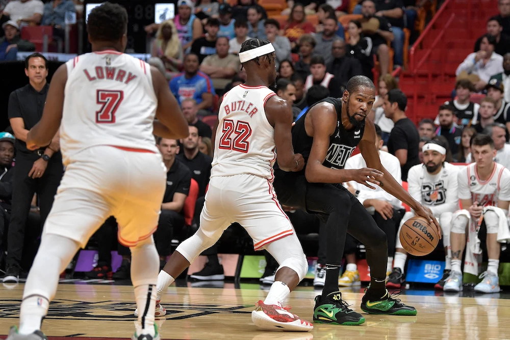 Brooklyn Nets forward Kevin Durant looks to drive on Miami Heat forward Jimmy Butler during the third quarter of their NBA game at FTX Arena on Sunday. (USA TODAY Sports)
