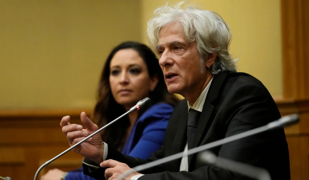 Pietro Orlandi, right, brother of Manuela, a 15-year-old daughter of a Vatican employee disappeared in 1983, is flanked by his lawyer Laura Sgro, left, as he attends a press conference on the establishing of a parliamentary investigative commission on Manuela Orlandi and other cold cases, in Rome, Dec. 20, 2022. (AP)